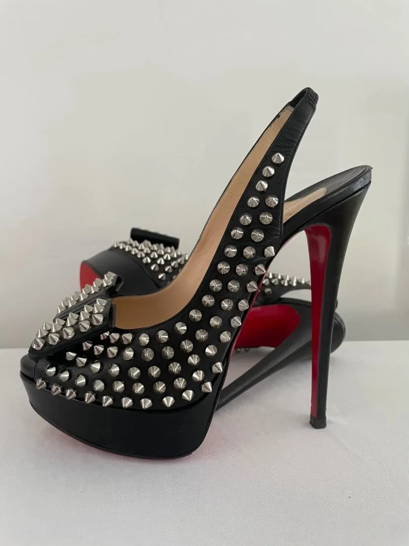 CHRISTIAN LOUBOUTIN
Black Clou Noeud Spikes 150mm Leather
Platform Peep Toe Slingback Pumps