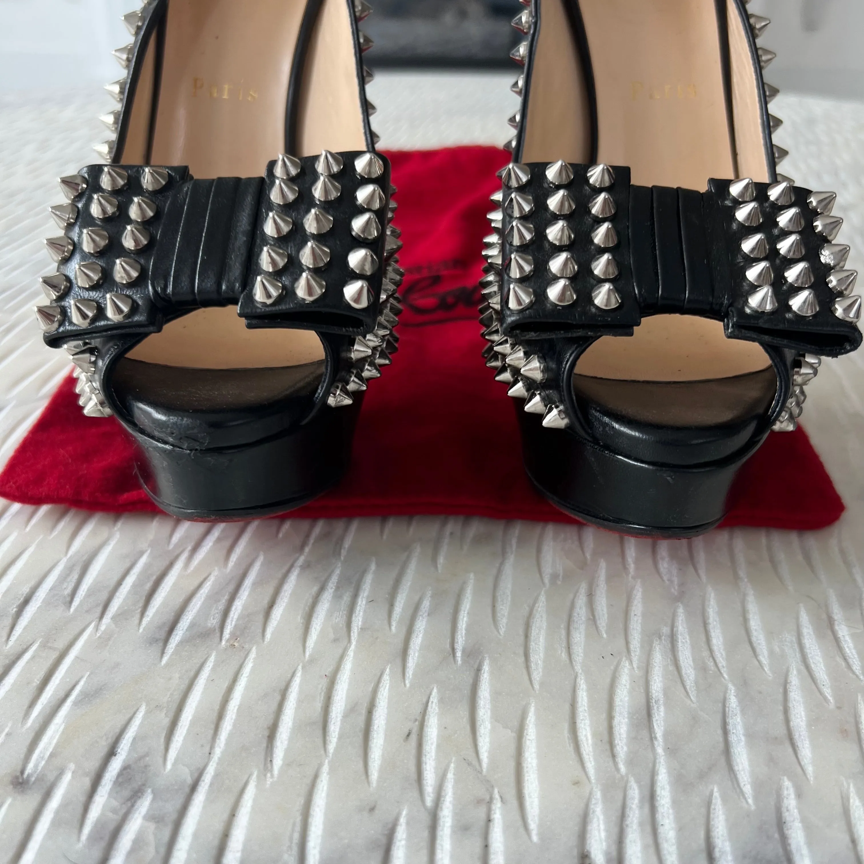 CHRISTIAN LOUBOUTIN
Black Clou Noeud Spikes 150mm Leather
Platform Peep Toe Slingback Pumps