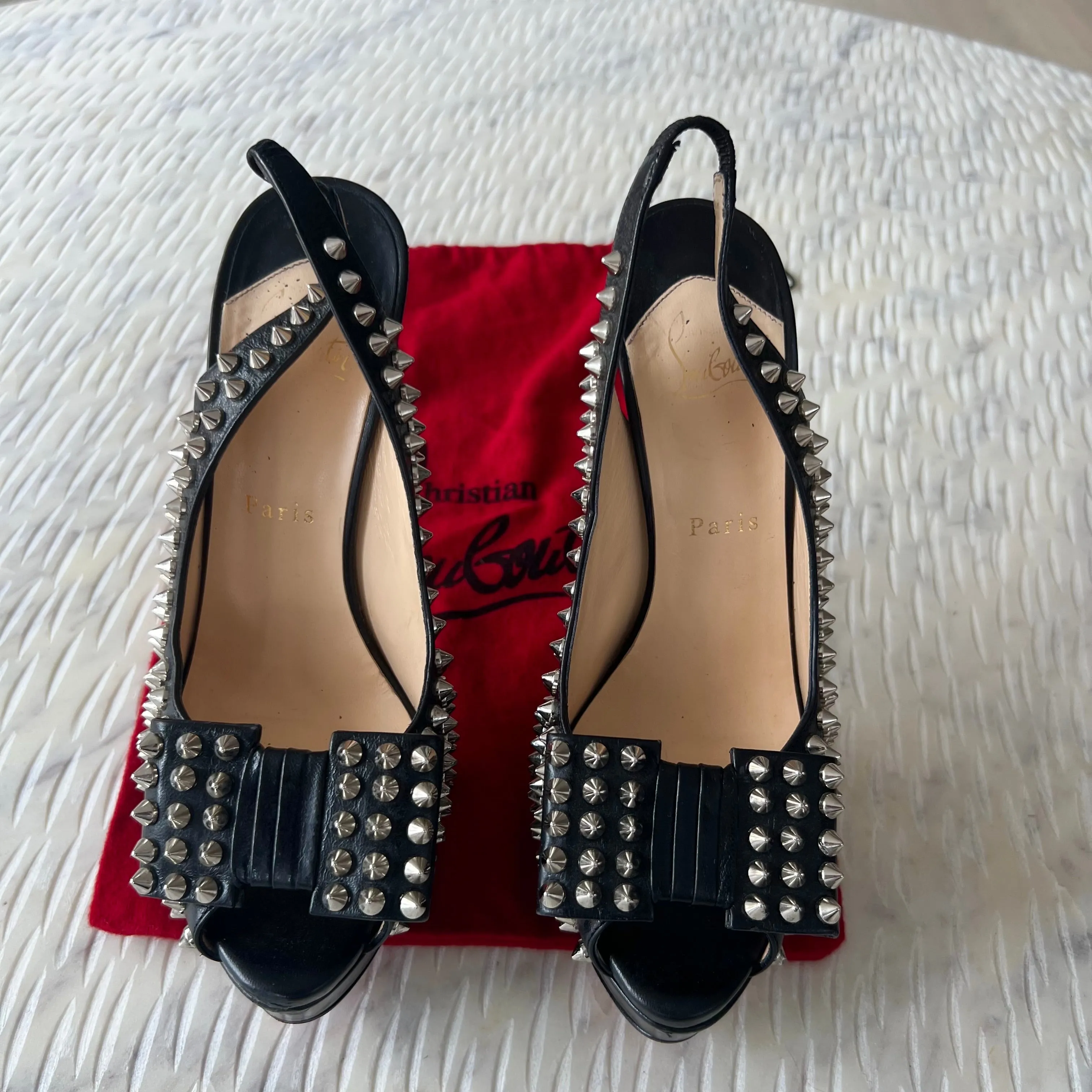 CHRISTIAN LOUBOUTIN
Black Clou Noeud Spikes 150mm Leather
Platform Peep Toe Slingback Pumps